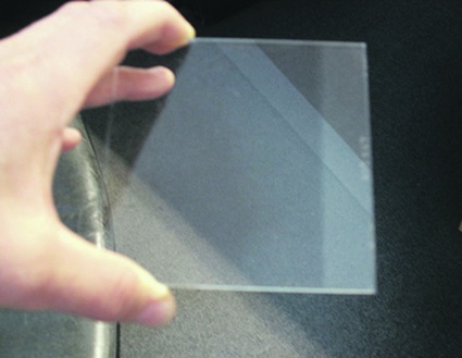 Figs. 1a and 1b: Plane glass surface coated with a hard, transparent...