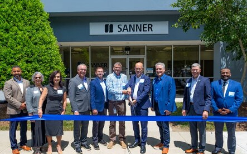 Company representatives at the ribbon cutting ceremony.