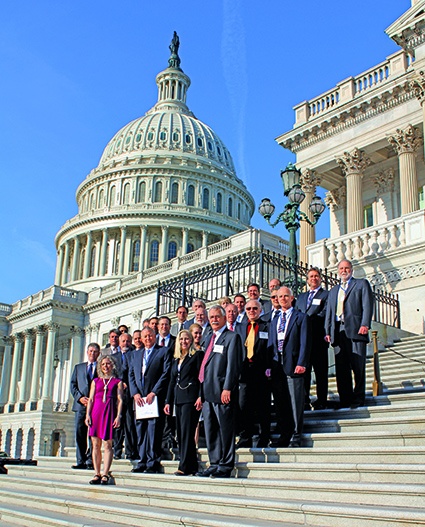 SOCMA members gather on the steps of the U.S. Senate for a photo before meeting...