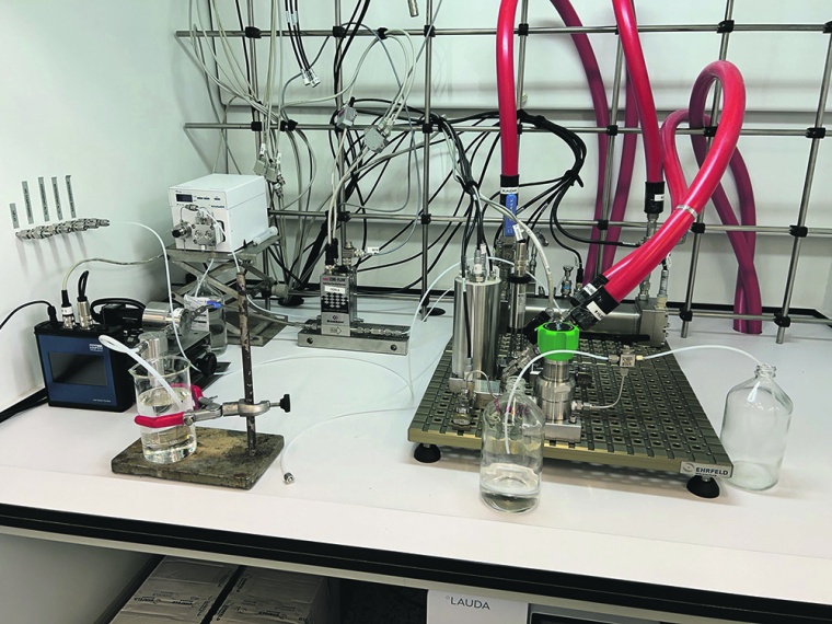 Fig. 1: Lab scale setup with a 30 mL reactor, two dosing units, sensors (mass...