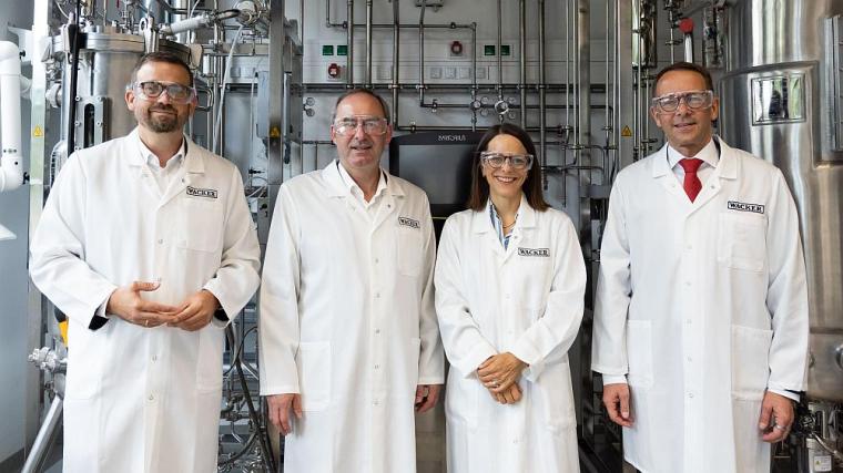 Company representatives in the new laboratory space